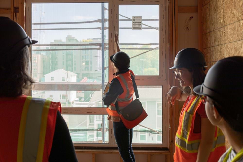 tour attendee at Solis checks out the operable windows