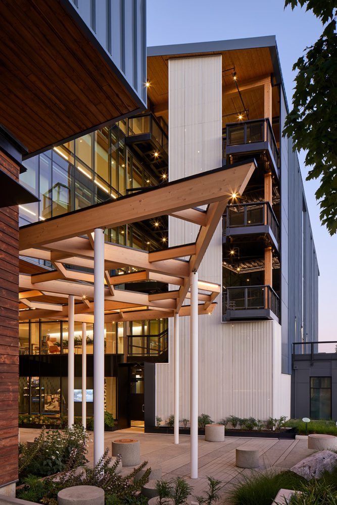 photo at dusk of the entry at 35 stone showcasing the timber pergola
