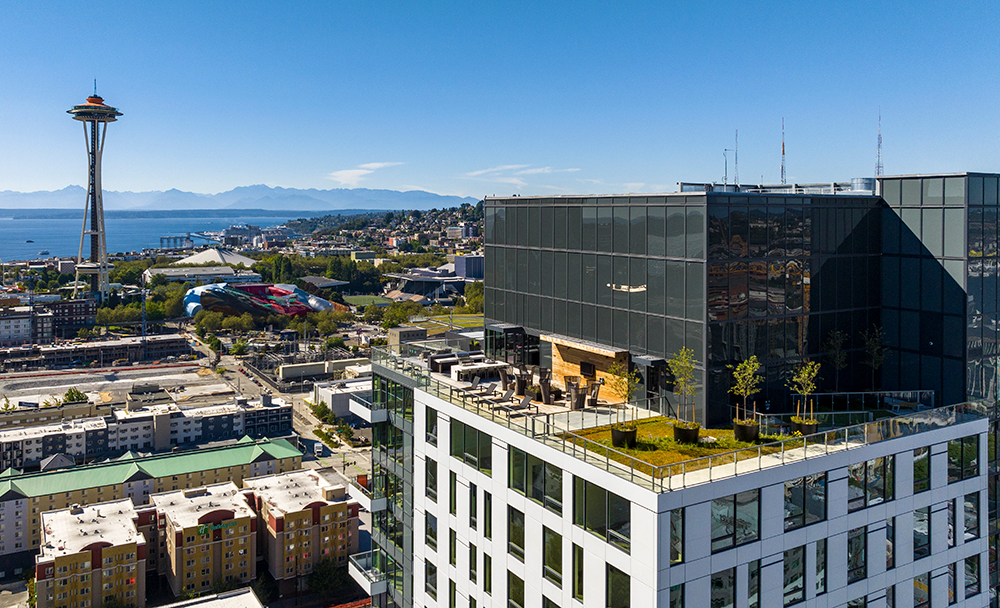 aerial photo of the roofdeck at the waverly on a sunny day with the space needle in the background