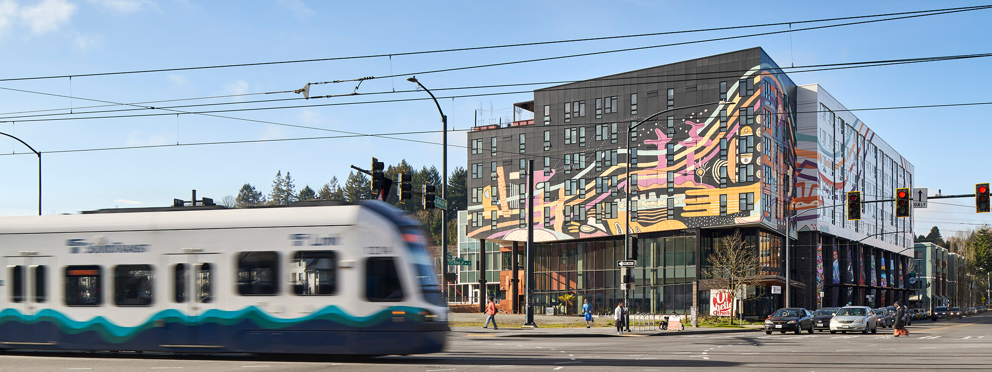 Orenda at Othello Square with the Light Rail train in the foreground
