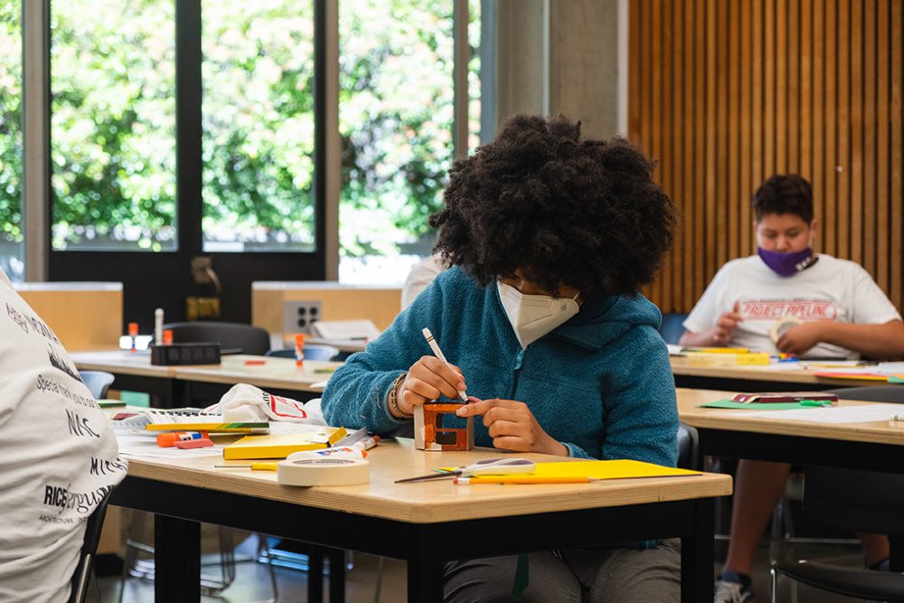 Photo of a girl student creating a model