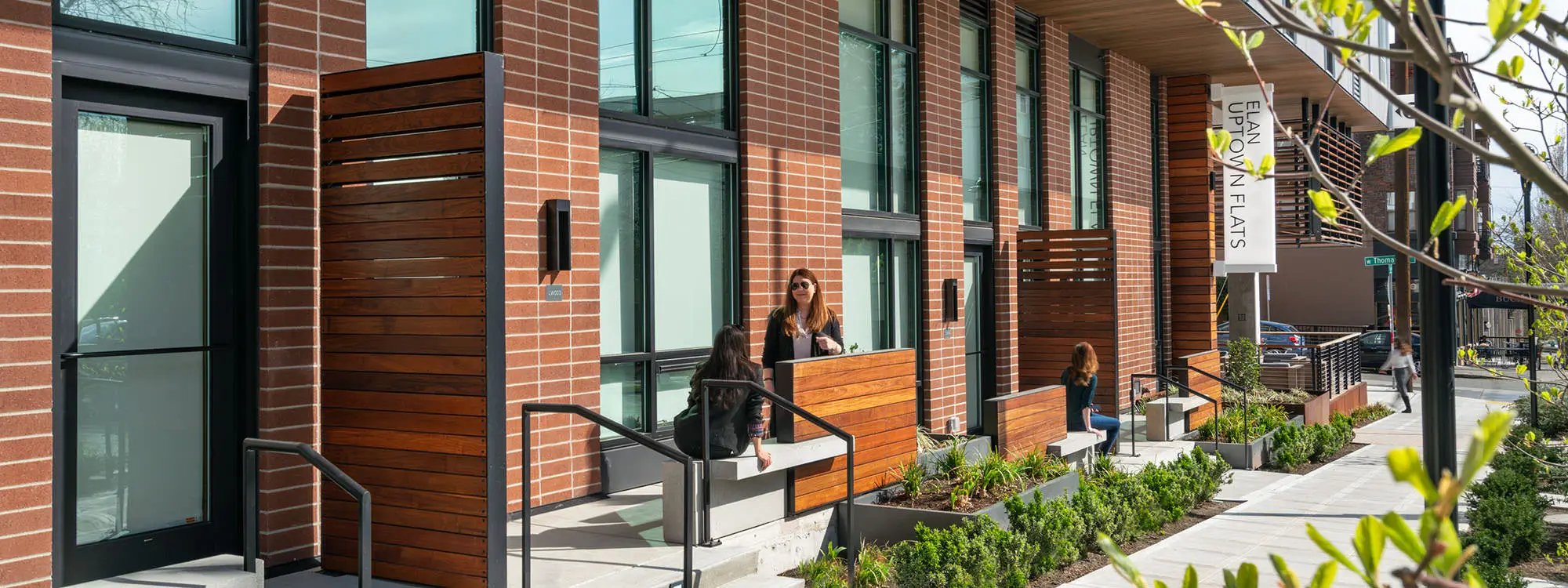 Photo of people sitting outside of Uptown Flats