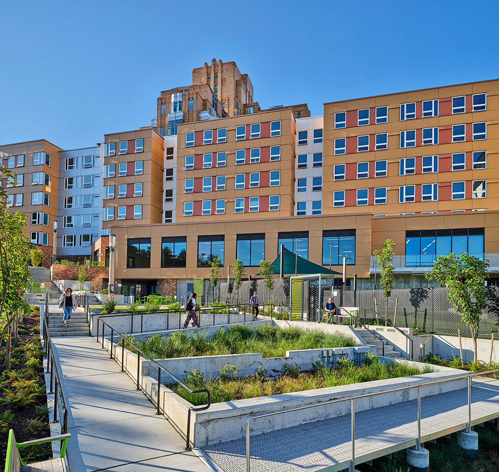 photo of the landscape exterior courtyard with beacon pacific village in the background
