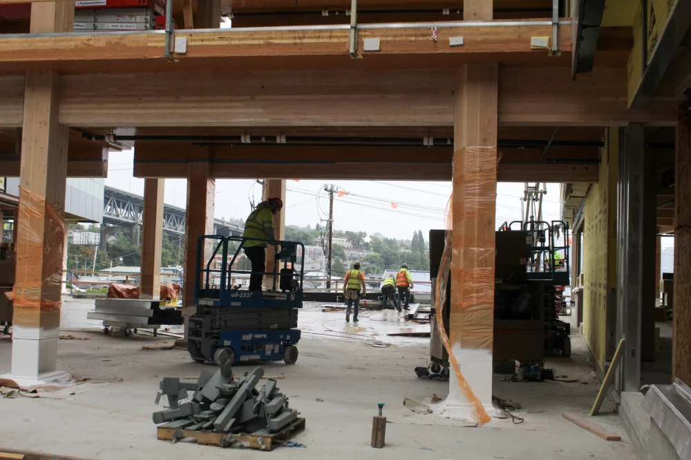 Photo inside Northlake Commons showing wooden planks glued together provide the columns and beams for buildings using mass timber construction. 