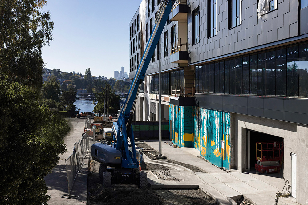 Photo of the exterior of Northlake Commons and the mural in progress