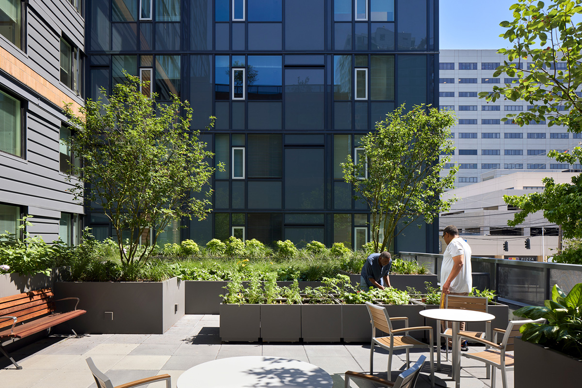 Photo of two residents looking at a garden on a terrace at Blake House