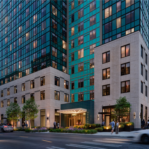 nighttime rendering showing the main entrance of the high rise