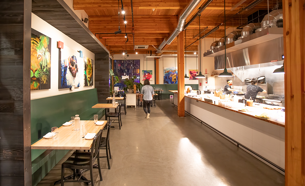 photo of the interior design at revel restaurant featuring mass timber interiors and biophilic design elements that create a warm welcoming environment
