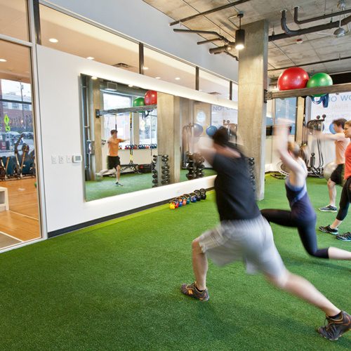 photo of the tenant improvement at rival fitness featuring people working out on turf