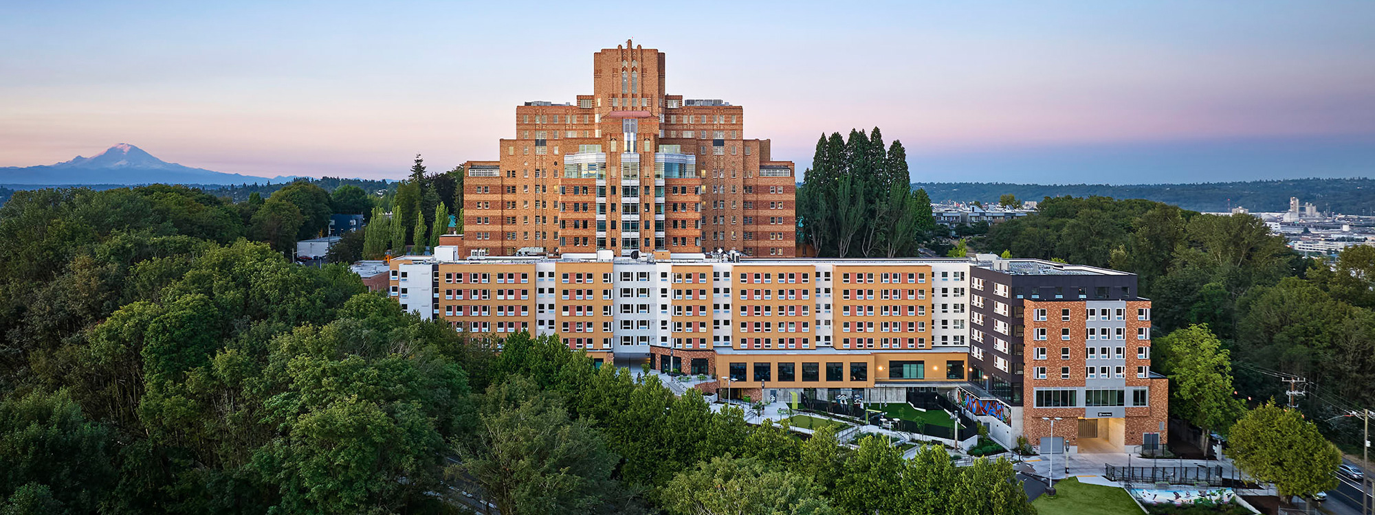 photo of beacon pacific village affordable housing development at dusk with mt rainier in the background