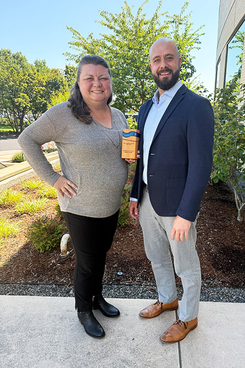 photo of rachael meyer and brian mickelson receiving the innovative stormwater award