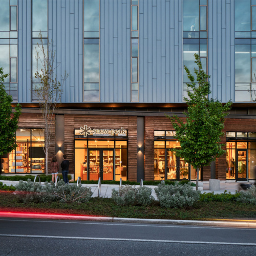 photo of the exterior of snow peak seattle located at cornerstone building in fremont at dusk